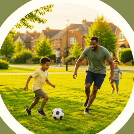 A dad and son playing football in the park
